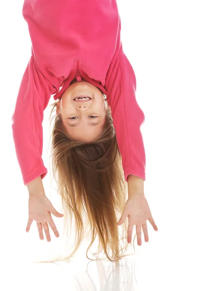 Girl hanging upside down — Stock Photo, Image