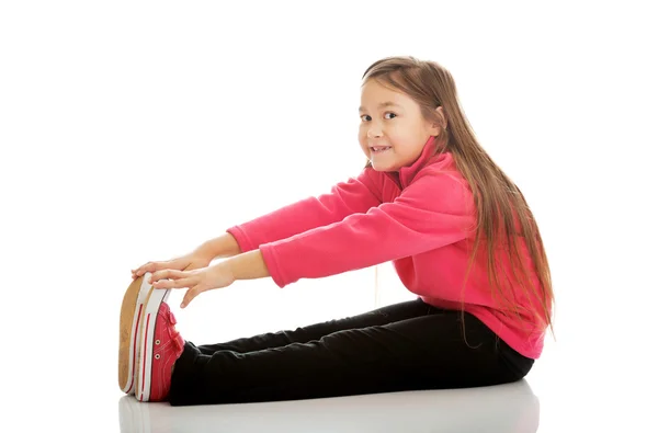 Girl doing gymnastics exercise — Stock Photo, Image