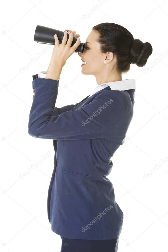 Businesswoman with a binocular