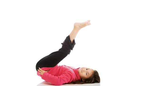 Girl doing gymnastics exercise — Stock Photo, Image