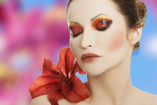 Young woman with red lilly — Stock Photo, Image