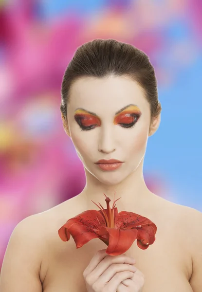 Young woman with red lilly — Stock Photo, Image