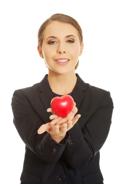 Business woman holding heart — стоковое фото