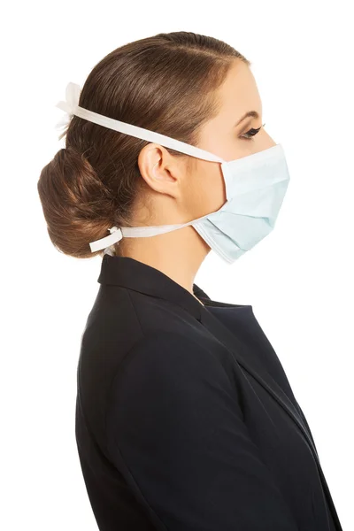 Donna d'affari indossando maschera medico — Foto Stock