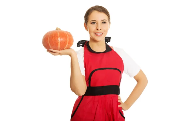 Young woman holding a pumpkin — Stock Photo, Image