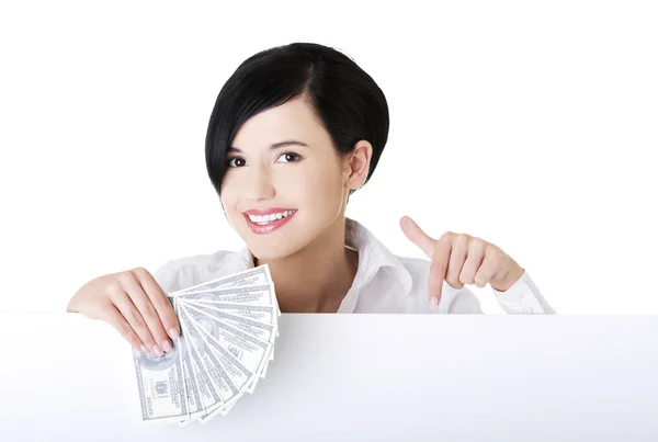 Woman holding money clip — Stock Photo, Image