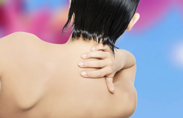 Nude woman with back pain — Stock Photo, Image