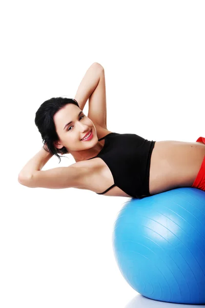 Young woman excercising on ball — Stock Photo, Image