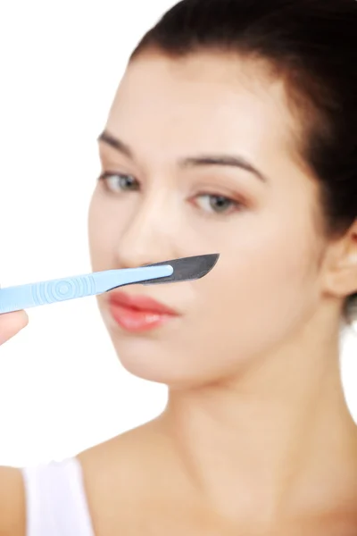 Scalpel near face — Stock Photo, Image