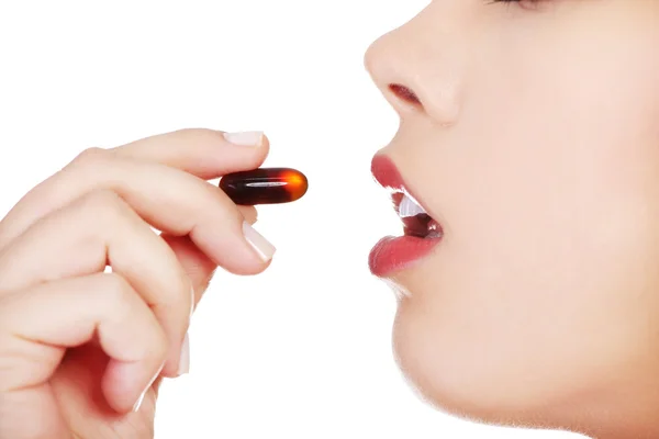 Woman taking pill — Stock Photo, Image