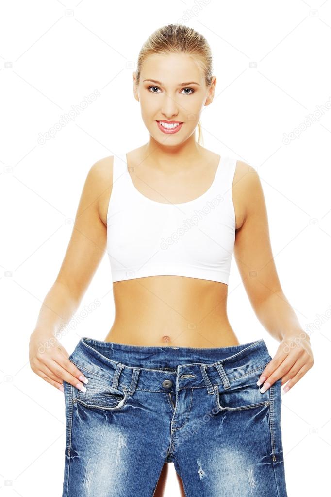 Woman with too large jeans