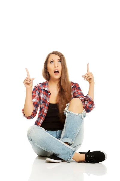 Woman sitting cross-legged — Stock Photo, Image