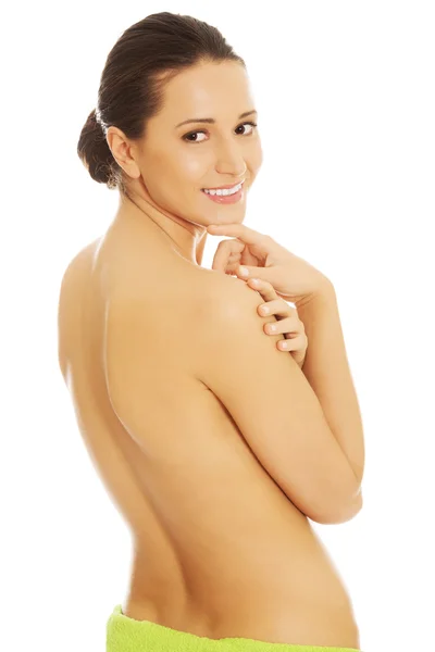 Nude woman wrapped in towel on hips — Stock Photo, Image