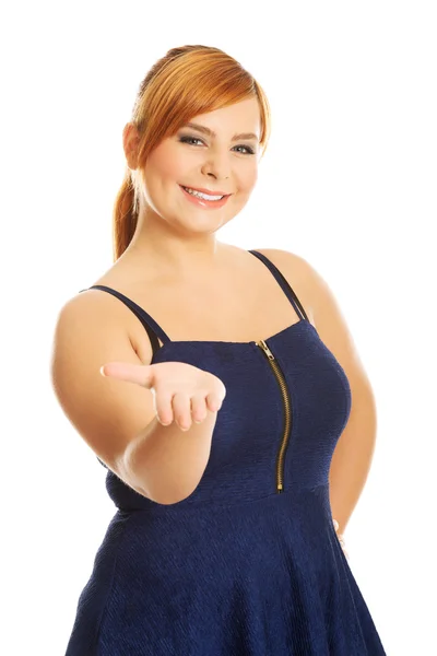 Overweight woman presenting something — Stock Photo, Image