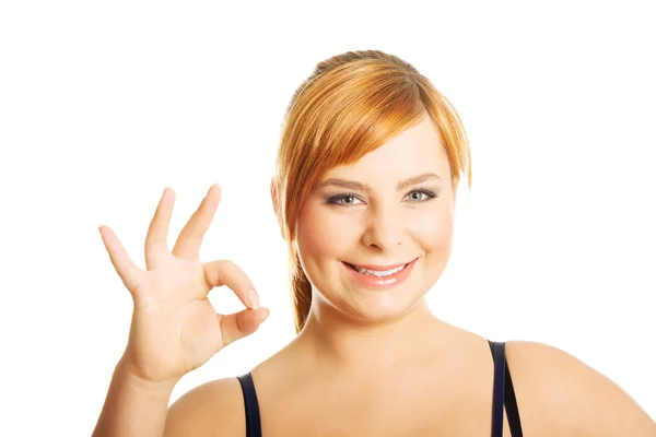 Portrait of overweight woman showing OK sign — Stock Photo, Image