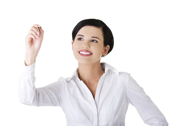 Empresaria dibujando en un tablero de cristal — Foto de Stock