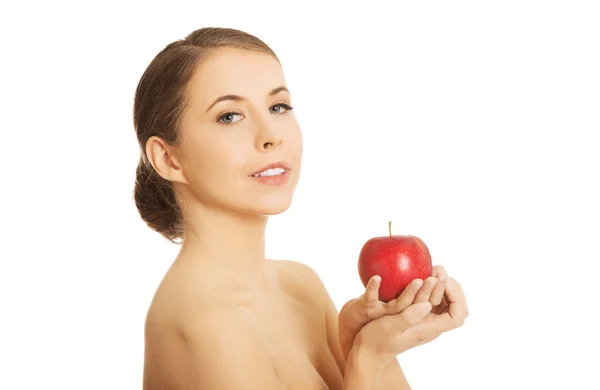 Woman holding an apple Royalty Free Stock Images