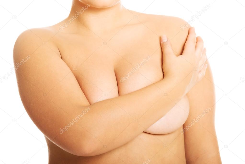 Woman covering her breast.