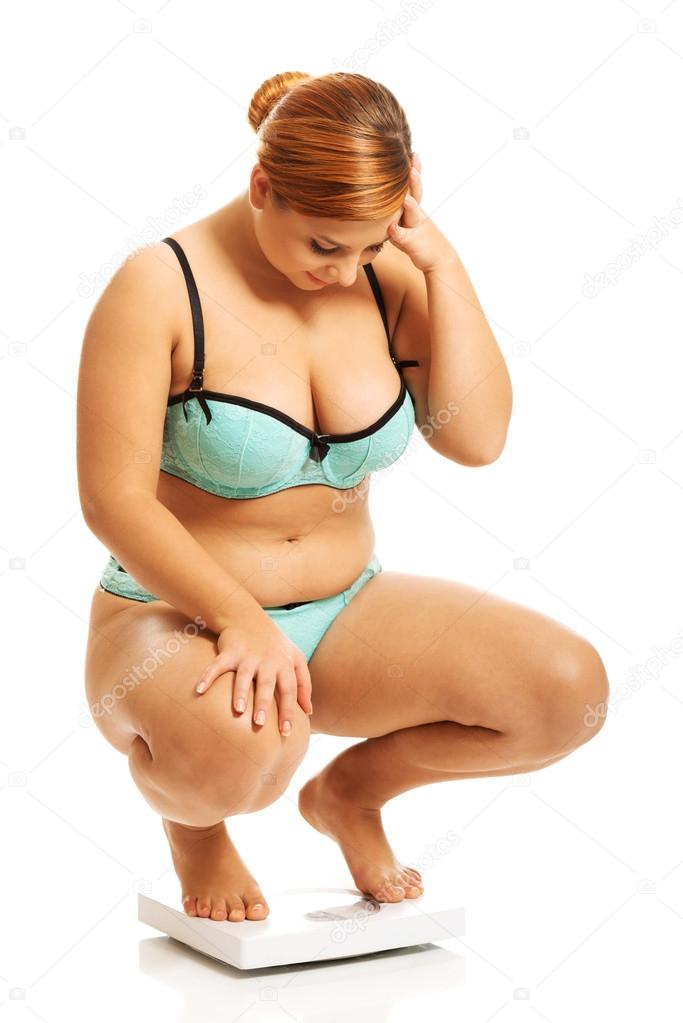 Fat woman squats on scale