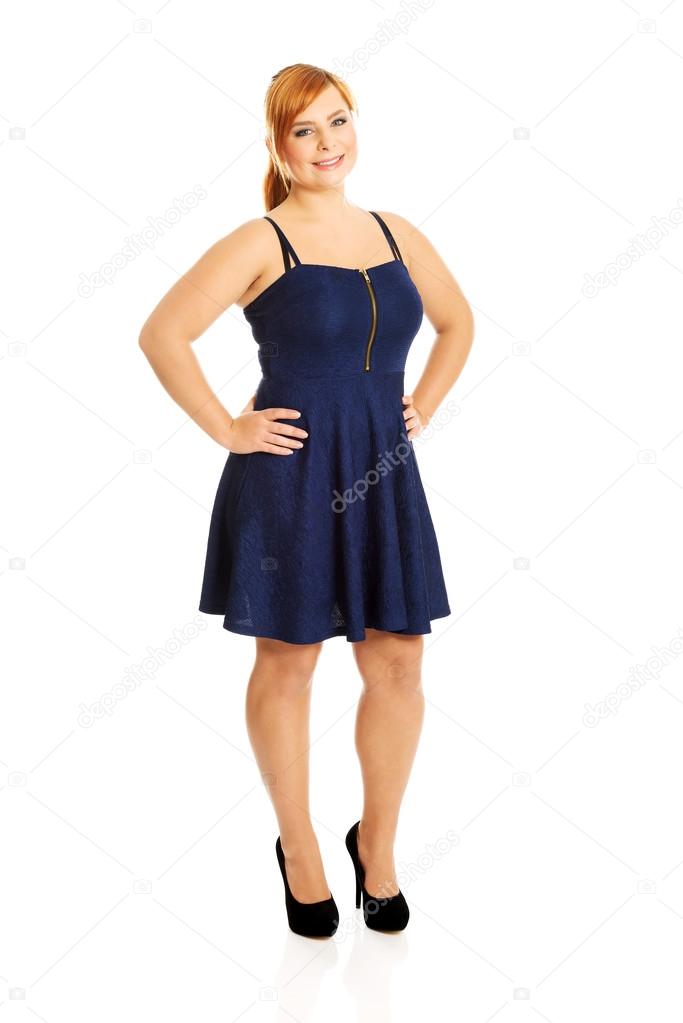 Plus size woman posing in skirt