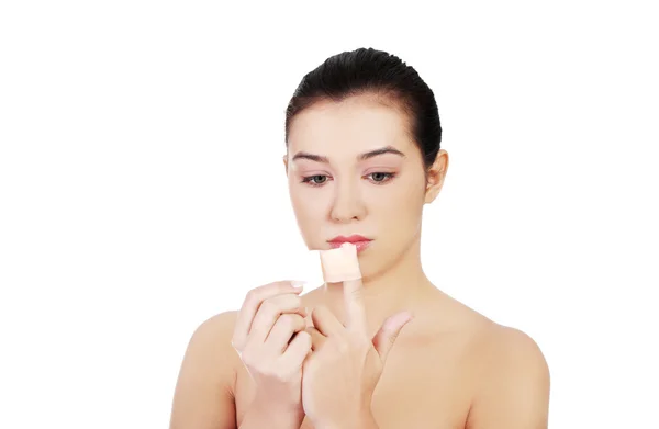 Woman applying patch — Stock Photo, Image