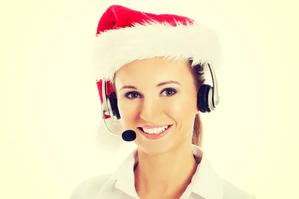 Mujer en sombrero de santa, micrófono y auriculares . —  Fotos de Stock