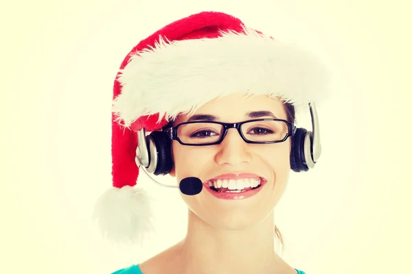 Vrouw in santa hat, microfoon en hoofdtelefoon — Stockfoto