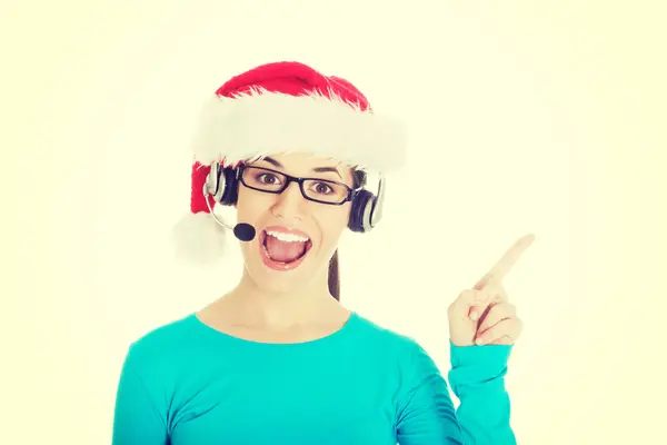 Woman in santa hat, microphone and headphones — Stock Photo, Image