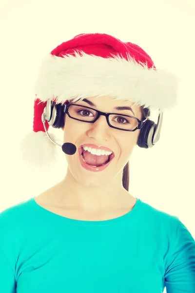 Woman in santa hat, microphone and headphones — Stock Photo, Image