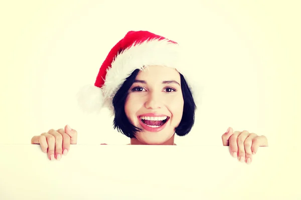 Santa chica sosteniendo tablero en blanco — Foto de Stock