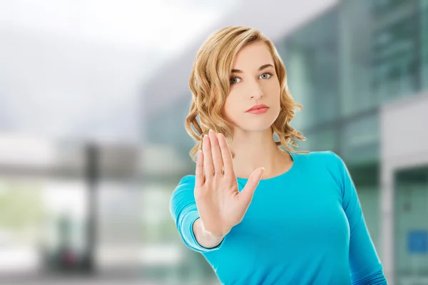 Woman showing stop sign — Stock Photo, Image