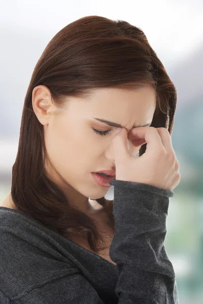 Woman with sinus pressure pain Stock Image