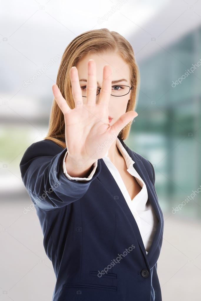 Businesswoman show NO gesture.