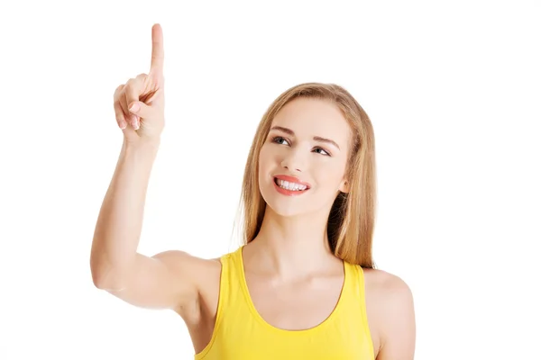 Woman pointing on a virtual screen — Stock Photo, Image