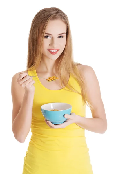 Happy woman eating cereals — Stock Photo, Image