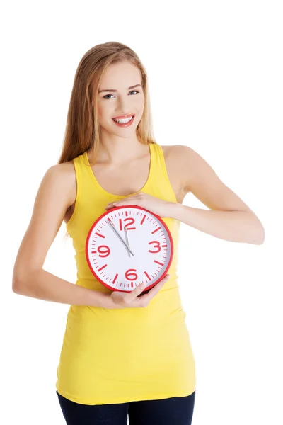 Woman holding big clock Stock Photo