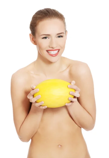 Woman holding yellow mango — Stock Photo, Image