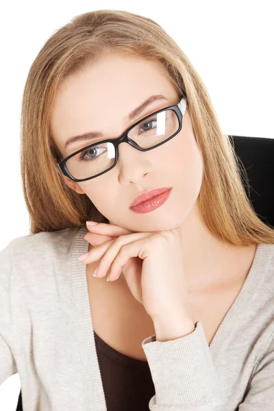 Thoughtful woman in glasses — Stock Photo, Image