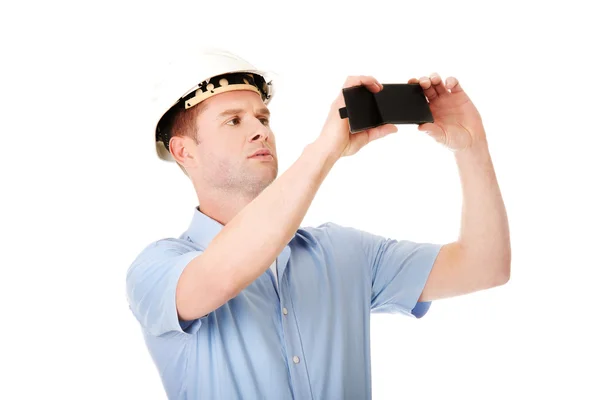 Handsome man taking photos by his mobile phone — Stock Photo, Image
