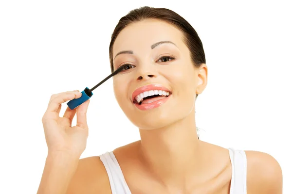 Portrait of a woman applying make up — Stock Photo, Image