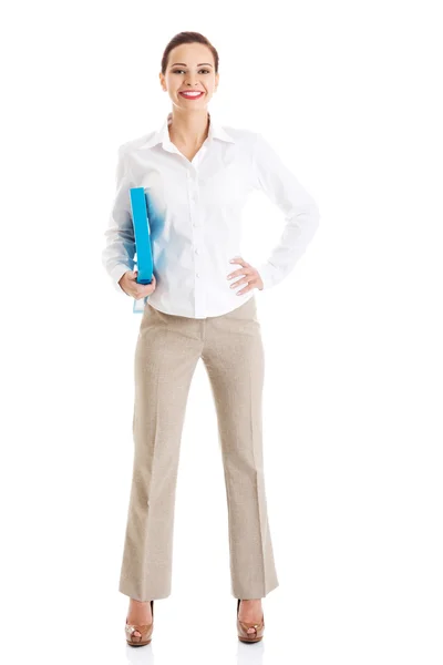 Full length businesswoman holding binder Royalty Free Stock Images