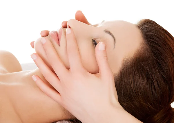 Woman relaxing in spa by getting face massage — Stock Photo, Image