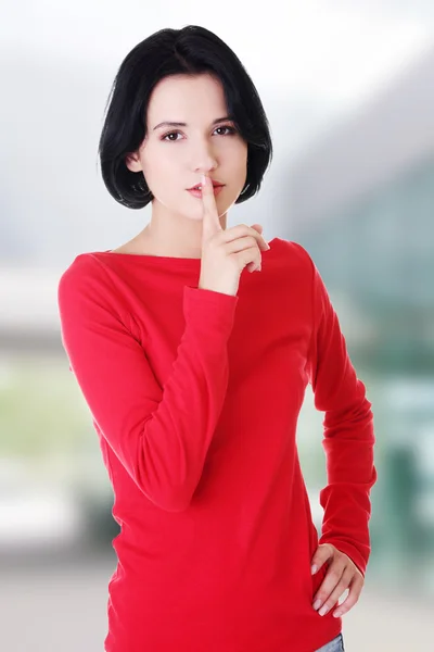 Woman making a keep it quiet gesture — Stock Photo, Image