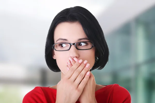 Shocked woman covering her mouth with hands — Stock Photo, Image