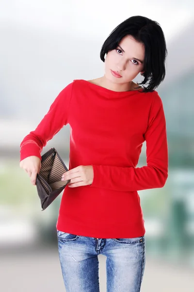 Young woman shows her empty wallet. — Stock Photo, Image