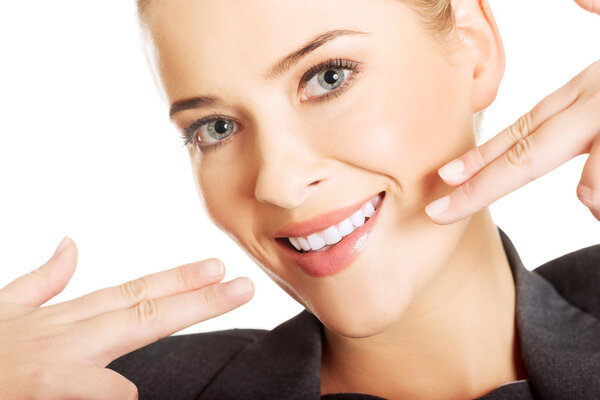 Woman showing her perfect white teeth