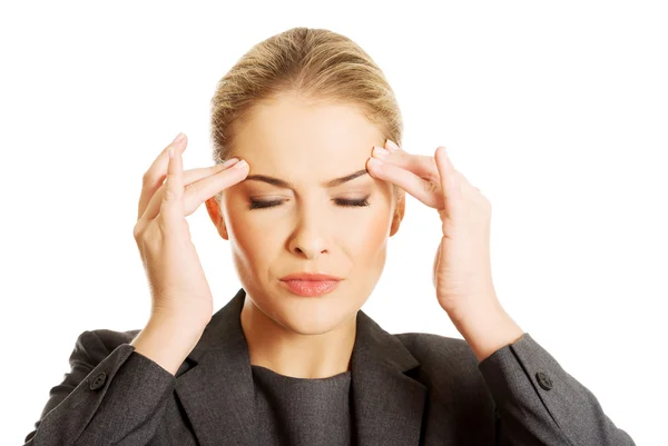 Businesswoman having huge headache — Stock Photo, Image