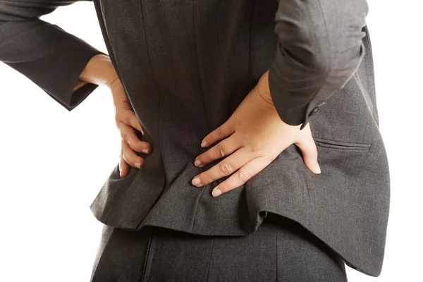 Mujer de negocios con dolor de espalda — Foto de Stock