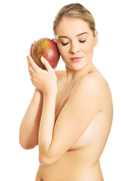 Woman hugging a mango — Stock Photo, Image