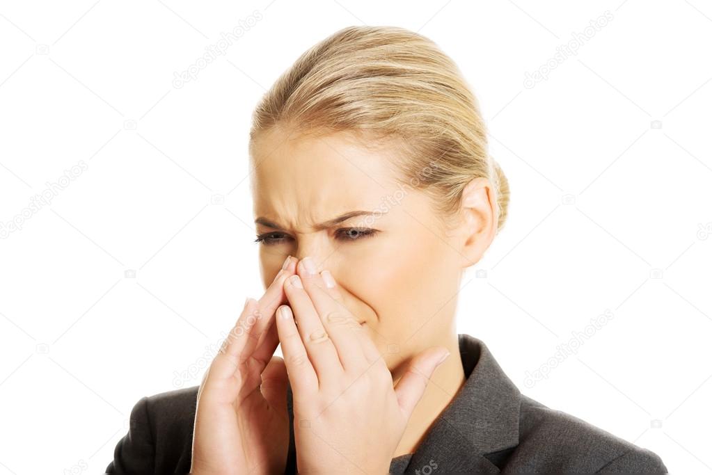 Woman pinching her nose